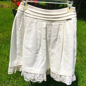 Never worn white Galliano skirt with lace trim.